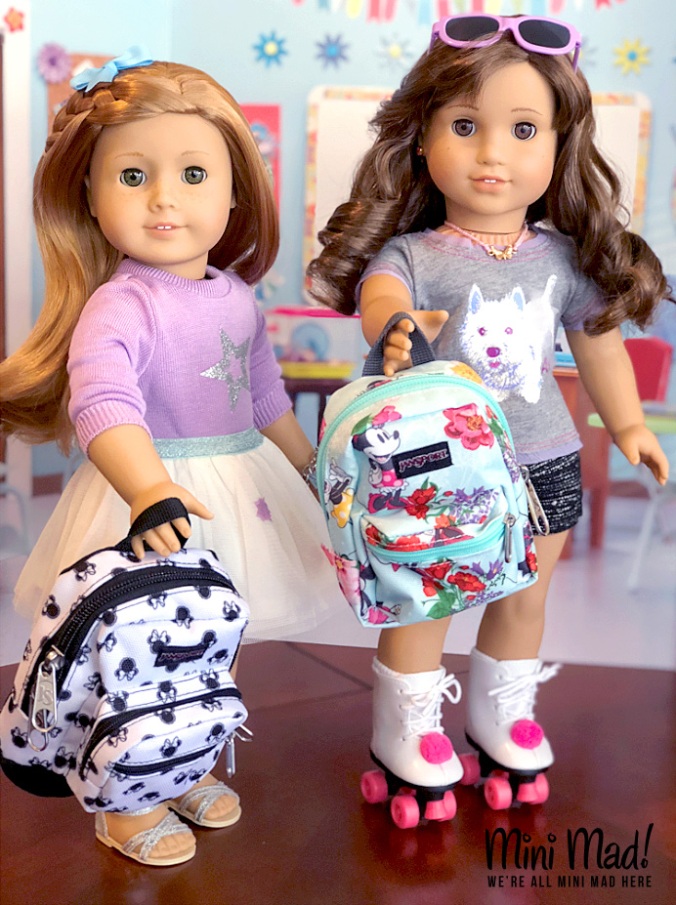 Megan and Mia hold their Disney backpacks.